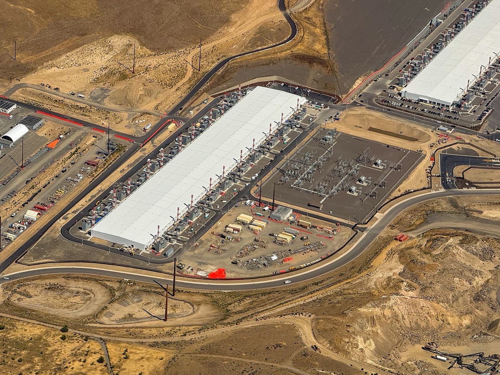 Aerial view of large data center buildings and an electrical substation in Wenatchee, Washington