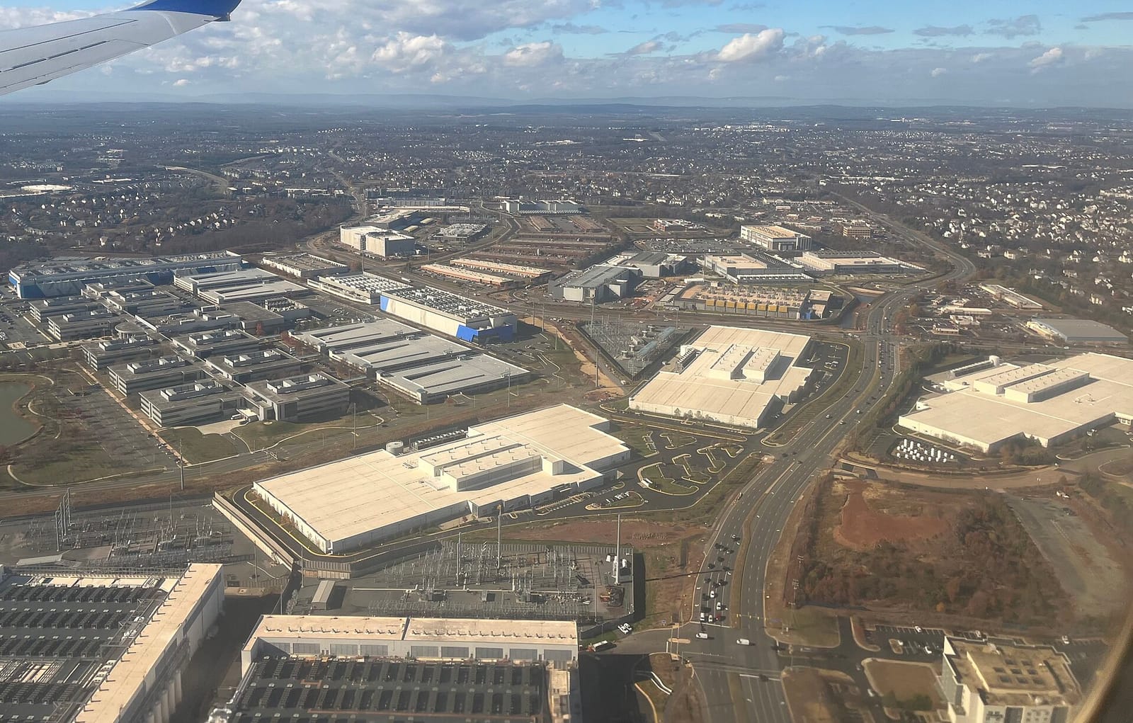 Aerial view of large data center buildings clustered in Loudoun County near Ashburn, Virginia