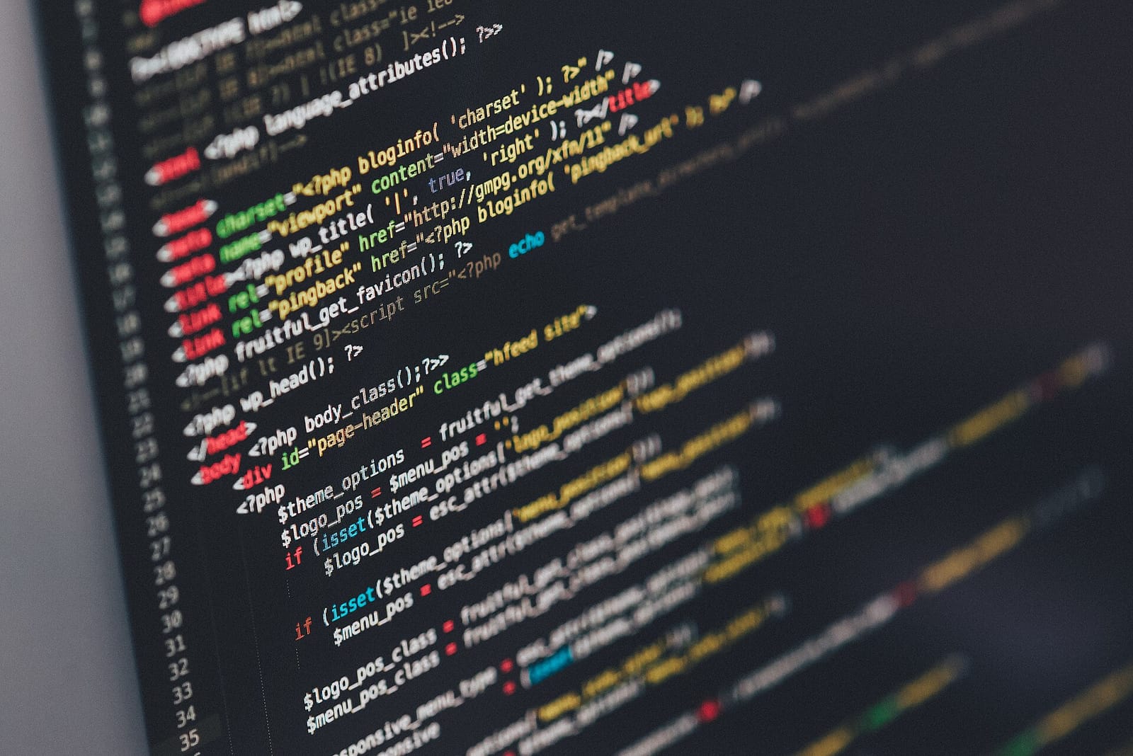 Close-up of syntax-highlighted source code on a dark computer screen