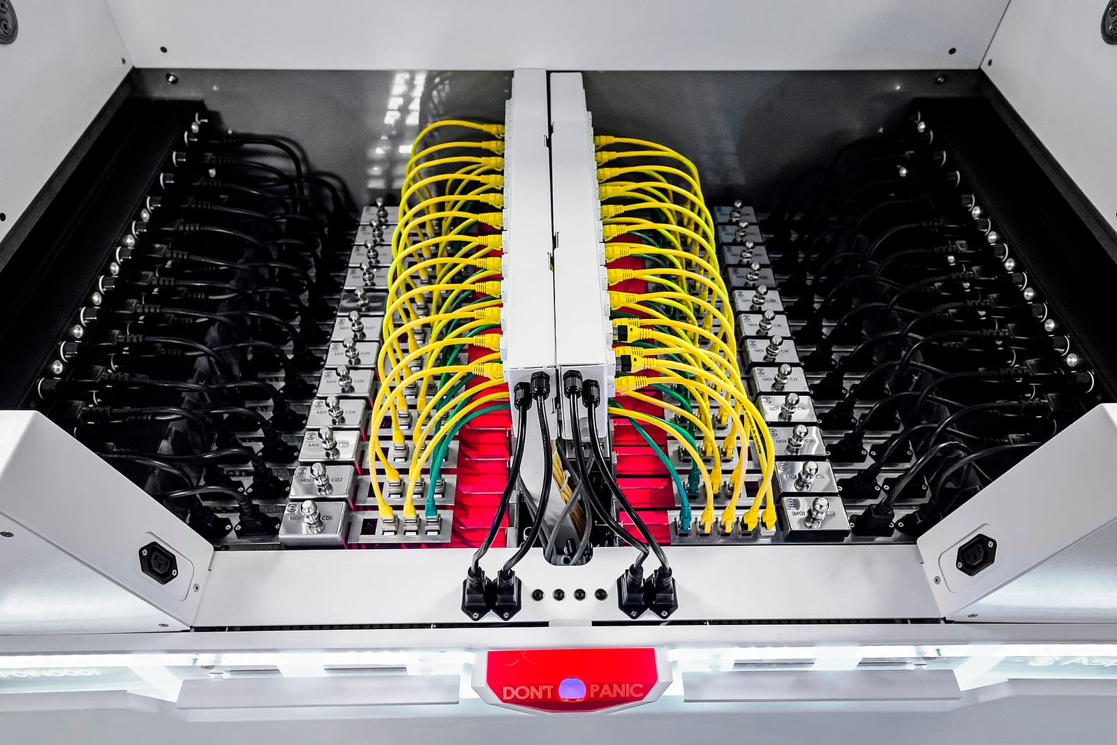 Servers submerged in an Asperitas immersion cooling tank, with network cables running along the top