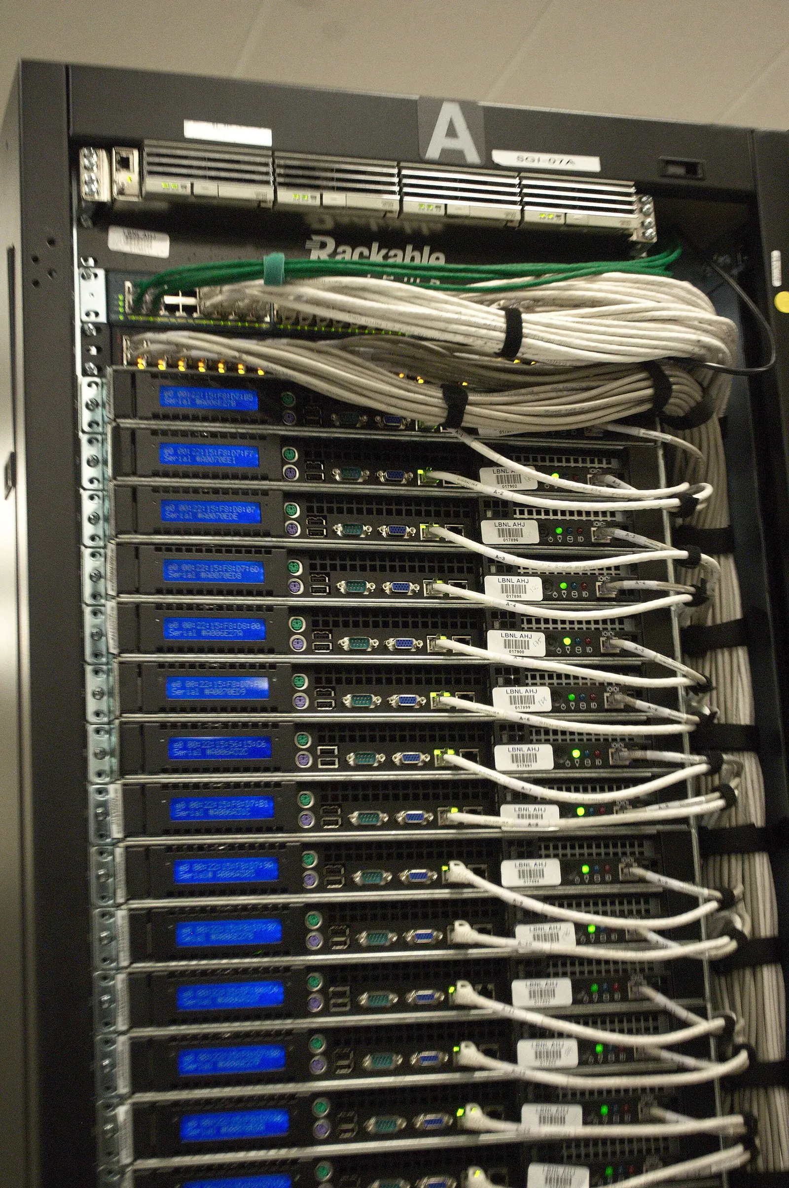 Rear of a server rack with cabling in a data center